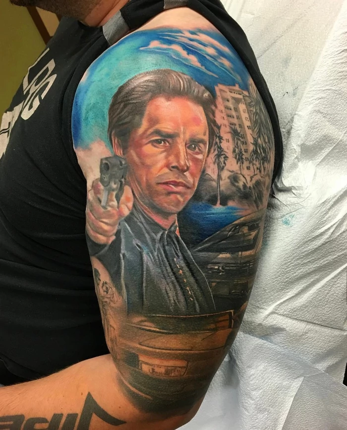 Casino gun portrait upper arm sleeve tattoo in partial color by artist Russ Howie of Sacred Mandala Studio in Durham, NC.